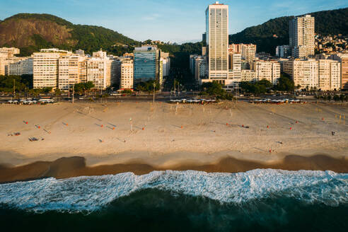 Aerial drone view of Leme Beach and Copacabana Beaches at sunrise with Princesa Isabel Avenue at centre, UNESCO World Heritage Site, Rio de Janeiro, Brazil, South America - RHPLF25249