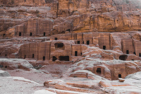 Caves carved in the stone of the mountain inside, Petra, UNESCO World Heritage Site, Jordan, Middle East - RHPLF25289