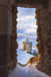 Winter view of the Renaissance church of Santa Maria della Pieta with snow seen from the castle of Rocca Calascio, Gran Sasso e Monti della Laga National Park, Campo Imperatore, L'Aquila province, Abruzzo, Italy, Europe - RHPLF25315