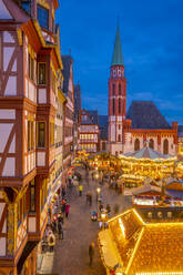 View of carousel and Christmas Market stalls at dusk, Roemerberg Square, Frankfurt am Main, Hesse, Germany, Europe - RHPLF25369