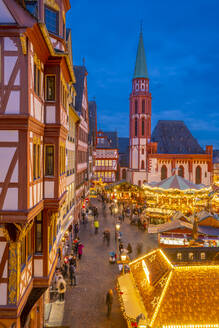 View of carousel and Christmas Market stalls at dusk, Roemerberg Square, Frankfurt am Main, Hesse, Germany, Europe - RHPLF25369