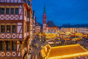 View of carousel and Christmas Market stalls at dusk, Roemerberg Square, Frankfurt am Main, Hesse, Germany, Europe - RHPLF25370