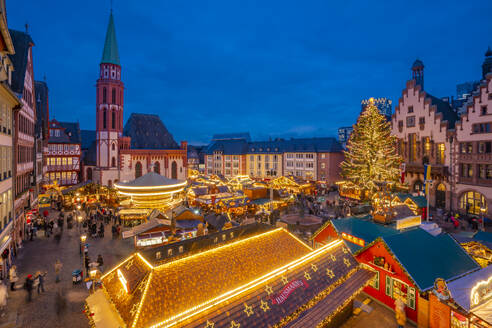 View of carousel and Christmas Market stalls at dusk, Roemerberg Square, Frankfurt am Main, Hesse, Germany, Europe - RHPLF25371