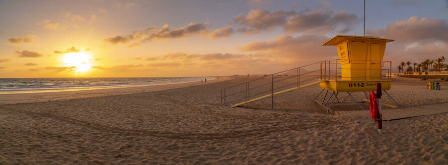 View of beach, lifeguard tower and the Atlantic Ocean at sunrise, Corralejo Natural Park, Fuerteventura, Canary Islands, Spain, Atlantic, Europe - RHPLF25392