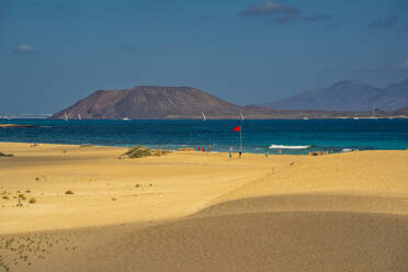 View of beach, Lobos Island and the Atlantic Ocean on a sunny day, Corralejo Natural Park, Fuerteventura, Canary Islands, Spain, Atlantic, Europe - RHPLF25396