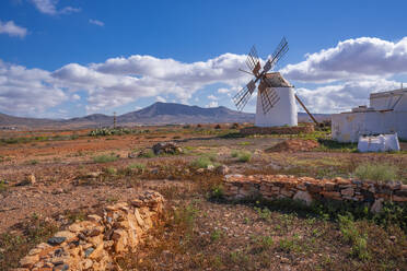 View of windmill in dramatic landscape near La Matilla, Fuerteventura, Canary Islands, Spain, Atlantic, Europe - RHPLF25401