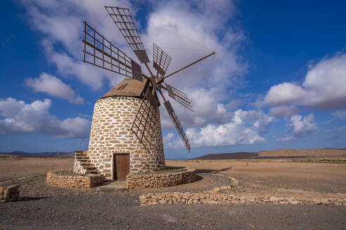 View of traditional windmill and landscape on a sunny day, La Oliva, Fuerteventura, Canary Islands, Spain, Atlantic, Europe - RHPLF25416