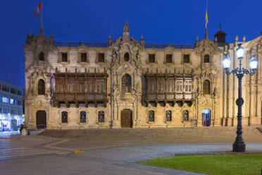 Facade and balconies, Archbishop's Palace at night, Lima, Peru, South America - RHPLF25426