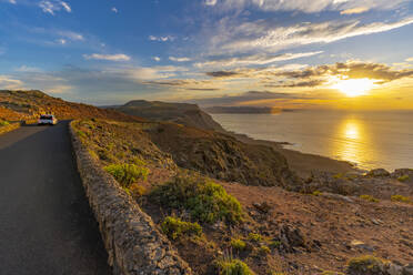 View of road and volcanic coastline from Mirador del Rio at sunset, Lanzarote, Las Palmas, Canary Islands, Spain, Atlantic, Europe - RHPLF25510