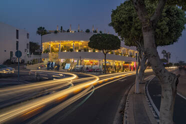 View of shops and bars at dusk, Puerto del Carmen, Lanzarote, Las Palmas, Canary Islands, Spain, Atlantic, Europe - RHPLF25513