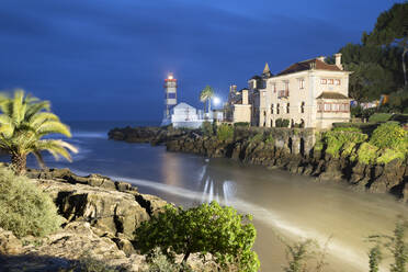 Santa Marta Lighthouse Museum and Casa Museu de Santa Maria floodlit at dawn, Cascais, Lisbon Region, Portugal, Europe - RHPLF25524