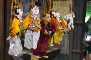 Close-up of Burmese puppet (Yoke the) (marionettes) hanging from strings on market, Nyaungshwe, Lake Inle, Shan State, Myanmar (Burma), Asia - RHPLF25535