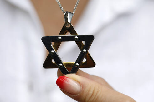 Woman wearing a Star of David (Jewish Star) pendant, Vietnam, Indochina, Southeast Asia, Asia - RHPLF25563