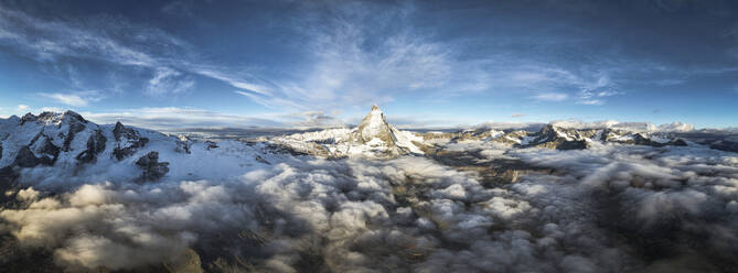 Aerial view of Matterhorn mountain peak in a sea of clouds at dawn, Zermatt, canton of Valais, Switzerland, Europe - RHPLF25623