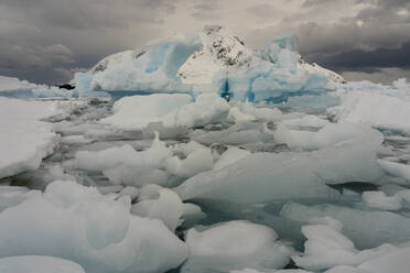Ice drifting and iceberg in Paradise Bay, Antarctica, Polar Regions - RHPLF25749