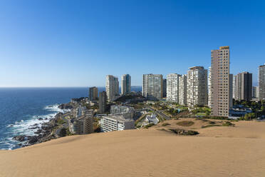 Sand dunes and residential high-rise buildings, Concon, Valparaiso Province, Valparaiso Region, Chile, South America - RHPLF25853