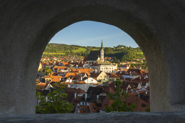 Historic town of Cesky Krumlov and Cesky Krumlov Caste Tower framed by opening, UNESCO World Heritage Site, Cesky Krumlov, South Bohemian Region, Czech Republic (Czechia), Europe - RHPLF25864