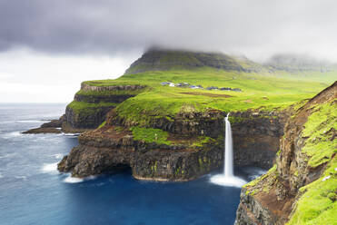 The iconic waterfall of Mulafossur, Gasadalur, Vagar, Faroe islands, Denmark, Northern Europe, Europe - RHPLF25874