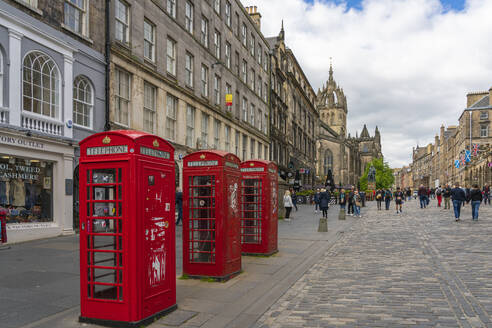 Red phone booths at Royal Mile with St. Giles Cathedral in background, UNESCO World Heritage Site, Edinburgh, Scotland, United Kingdom, Europe - RHPLF25960