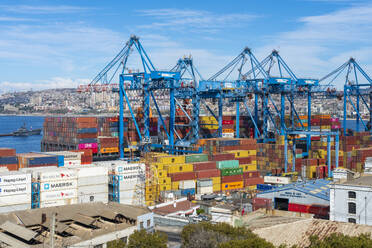 Cranes and cargo containers stacked at Port of Valparaiso, Valparaiso, Valparaiso Province, Valparaiso Region, Chile, South America - RHPLF25971