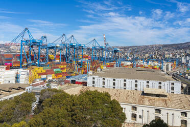 Cranes and cargo containers stacked at Port of Valparaiso, Valparaiso, Valparaiso Province, Valparaiso Region, Chile, South America - RHPLF25973
