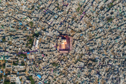 Aerial view of people celebrating the Holi Colour festival at Shri And Baba Temple in Nandgaon, Uttar Pradesh, India. - AAEF18330