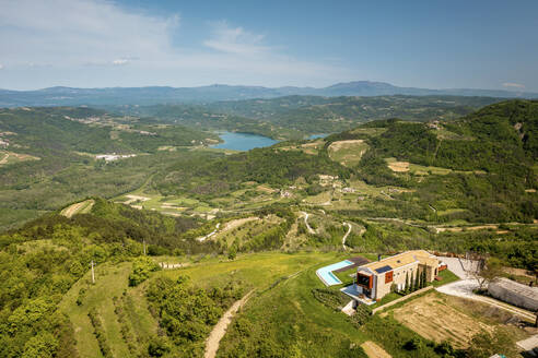 Aerial view of Zamask village with Butonega lake, located in central Istria, Croatia. - AAEF18379