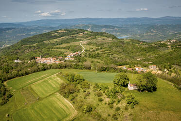 Aerial view of Kascerga village and the green surroundings of central IStria, Croatia. - AAEF18380