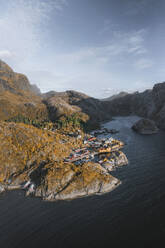 Aerial view of a little town in a fjord on the Lofoten Islands at sunrise, Nusfjord, Norway. - AAEF18411