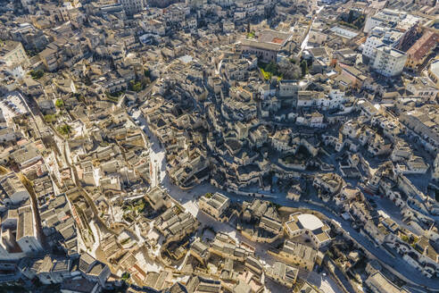 Aerial view of Sassi di Matera, an ancient old town along the mountain crest, Matera, Basilicata, Italy. - AAEF18438