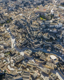 Aerial view of Sassi di Matera, an ancient old town along the mountain crest, Matera, Basilicata, Italy. - AAEF18439