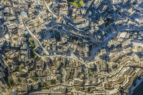 Aerial view of Sassi di Matera, an ancient old town along the mountain crest, Matera, Basilicata, Italy. - AAEF18443