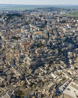 Aerial view of Sassi di Matera, an ancient old town along the mountain crest, Matera, Basilicata, Italy. - AAEF18444