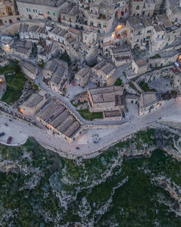 Aerial view of Sassi di Matera at sunset, an ancient old town along the mountain crest, Matera, Basilicata, Italy. - AAEF18451