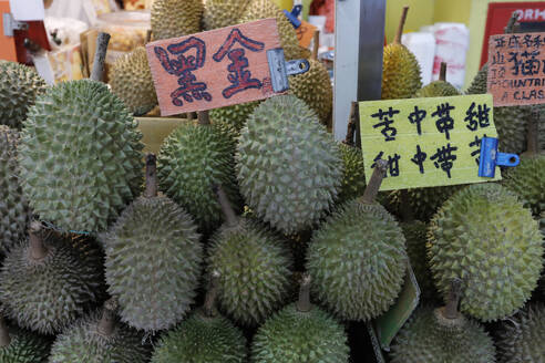 Durians for sale on a small street fruit market in Chinatown, Singapore, Southeast Asia, Asia - RHPLF26021