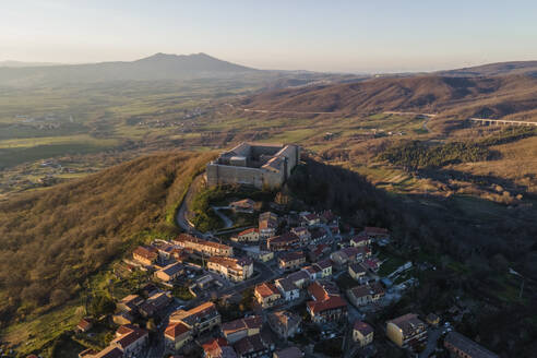 Aerial view of Castel Lagopesole, a small town with a fort on hilltop, Avigliano, Potenza, Basilicata, Italy. - AAEF18479