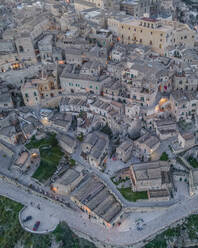 Aerial view of Sassi di Matera at sunset, an ancient old town along the mountain crest, Matera, Basilicata, Italy. - AAEF18510