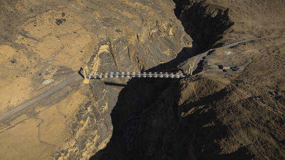 Aerial view of Shimshal bridge on Shimshal Valley Road, Hunza, Gilgit Baltistan, Pakistan. - AAEF18537