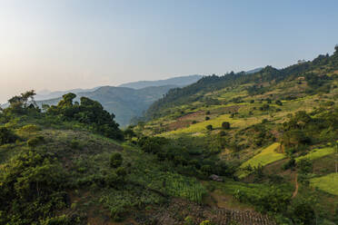 Aerial view of a hilly landscape at sunset Van Chan, Vietnam. - AAEF18559