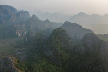 Aerial view of Khu Bao Ton hilly landscape at sunset, Gia Vien, Vietnam. - AAEF18560