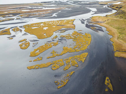 Aerial view of water formation from a river estuary in Iceland. - AAEF18571