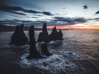 Aerial view of rock formation along the coastline at sunset in Iceland. - AAEF18579
