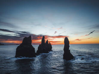 Aerial view of rock formation along the coastline at sunset in Iceland. - AAEF18580