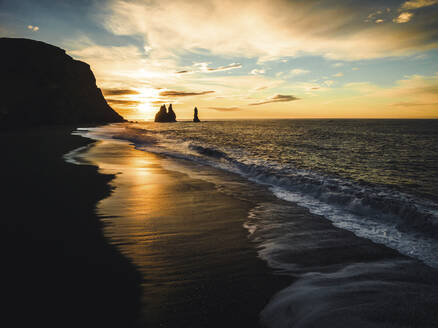 Aerial view of rock formation along the coastline at sunset in Iceland. - AAEF18581