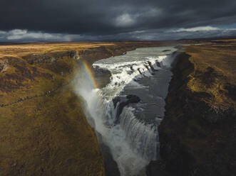 Aerial view of Olfusa river with rainbow at sunset, Gullfoss Nature reserve, Southern Region, Iceland. - AAEF18604