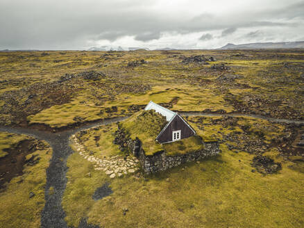 Aerial view of a rustic and traditional house in Southern Region, Iceland. - AAEF18609
