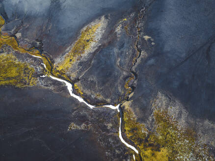 Aerial view of a small river across a volcanic valley in Austurland, Iceland. - AAEF18616