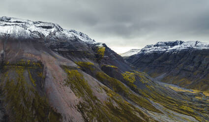 Aerial view of beautiful mountain range landscape with snow on the peaks in Austurland, Iceland. - AAEF18618