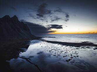 Aerial view of Stokksnes bay at sunset near the Vestrahorn mountain, Austurland, Iceland. - AAEF18624