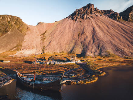 Aerial view of a Viking village with Vestrahorn Mountain in background, Austurland, Iceland. - AAEF18626